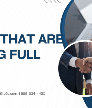 Professional reviewing listings for jobs that are hiring full time in the United States on a laptop in a modern office setting.